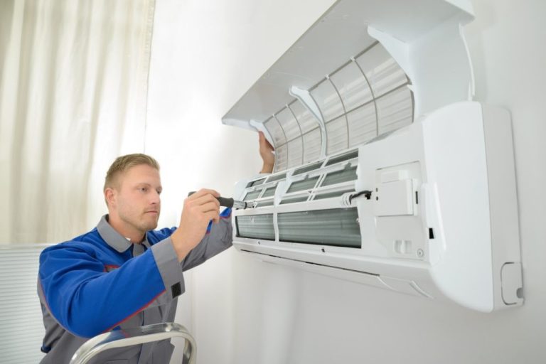 Technician working in a mini split unit