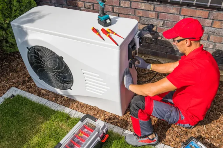 technician working on a heat pump unit