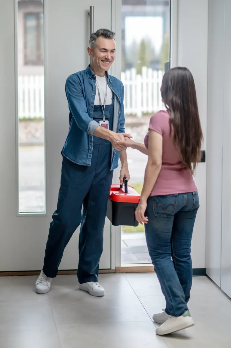 woman greetting hvac worker